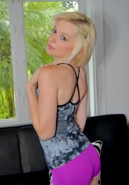 Innocent blonde Bailey Bradshaw gently touches pink pussy on couch