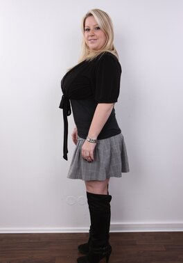 Blonde cutie manages to look sexy without concealing super colossal breasts