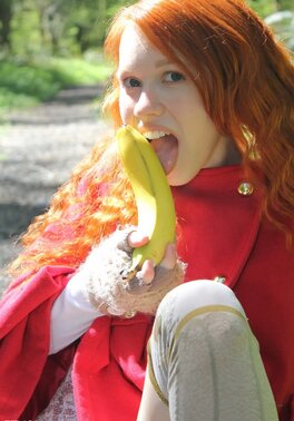 Little Red Riding Hood lost in the woods using banana to masturbate vagina