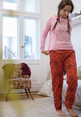 Pigtailed Marina covers her hairy pussy then gets dressed in cute pajama