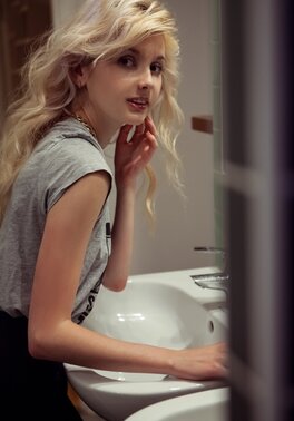After bathroom naughty blonde doesn't mind stripping naked for a photographer
