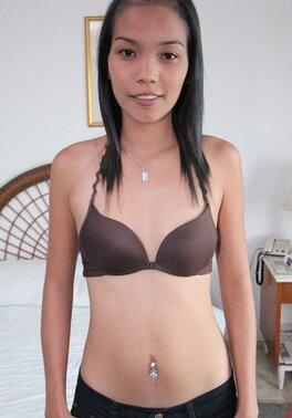 Sexy oriental girl exposes tiny boobs and hairy muff before sex action
