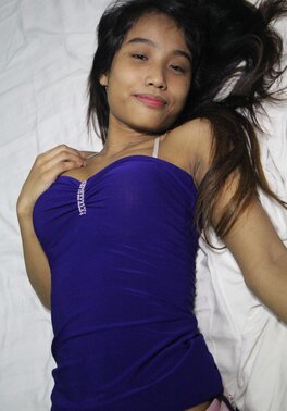 Filipina chick takes her pink underwear off and exposes trimmed cunt