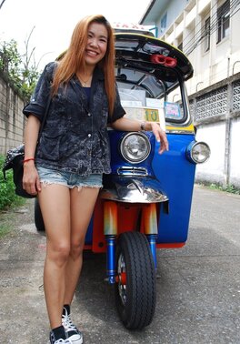 Clothed Thai girl with a cute face and red hair can brag about wonderful legs