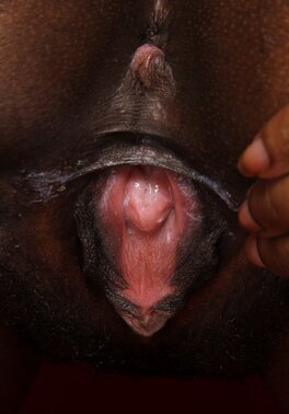 Babe with chocolate skin wears milky-white lingerie and shows pink pussy