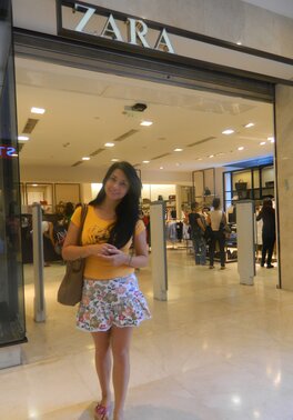 Young shopaholic acts very naughty in a fitting room located in the mall