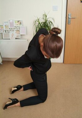 Office babe in high heels in a strict tuxedo suddenly gets tied up on the floor