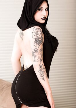 Pale-skinned brunette girl wears only black and masturbates on the floor