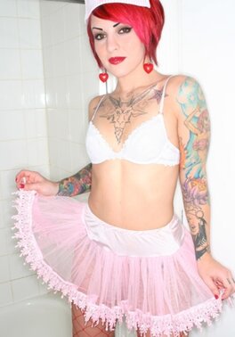 Nurse with red hair and meaningful tattoos over her body touches her cunt