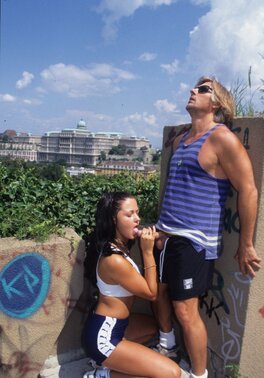 Brunette doesn't take her eyes off camera while guy is thrusting cock in her ass