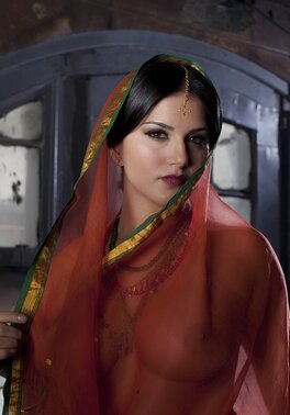 Diva in a transparent red sari fails to hide her big melons with dark nipples