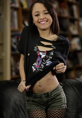 Fragile Latina gal with tiny tits seductively strips naked on leather couch