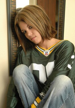 Football fan undresses and covers pussy using a piece of artificial cheese