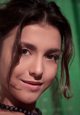 Tasty-looking young brunette reveals cute holes and tits posing on the stairs