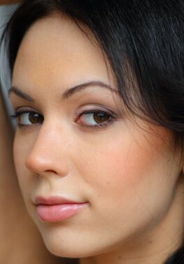 Fragile brunette knows that she is sexy and shamelessly poses completely naked