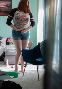 Curvy redhead Breanna is going to show her black panties too