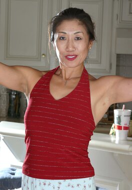 Hot Asian lady shows her bush and looks incredible as well