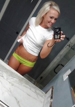 Towheaded colleen slips her panties whilst posing and taking selfies