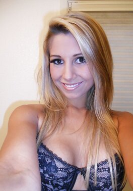 With a smile naughty blonde drops down lace lingerie whilst making selfies