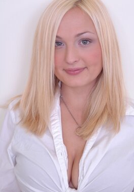 Blonde lovely in a white top and checkered skirt is a very dirty chick