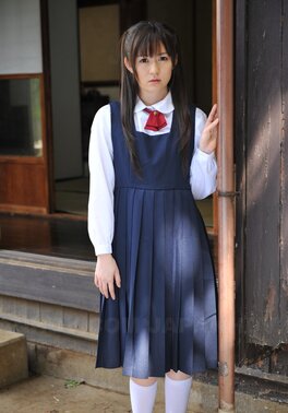 Innocent Japanese schoolgirl with beautiful eyes walks seductively under sun