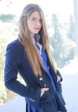 Enticing schoolgirl with sexy long hair Alice March flaunts her beautiful body
