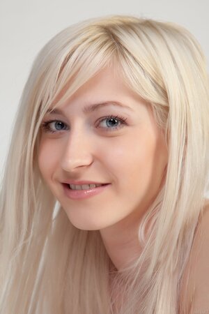 Pretty Russian blonde student takes off checkered shirt and skirt at photo shoot
