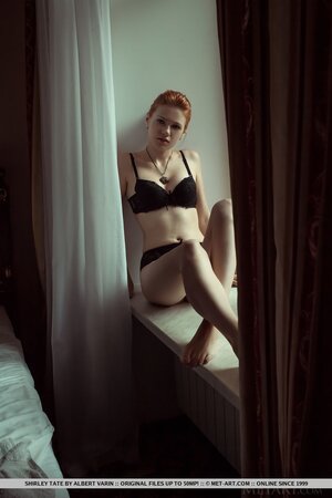 Red-haired sexpot Shirley Tate exposes her tiny assets in spacious studio