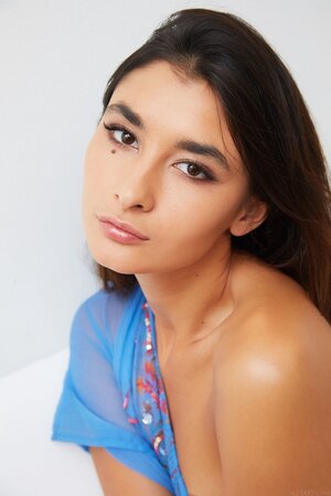 Feminine teen model Bambi Joli displays her small-tittied body and perfect holes