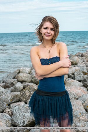Euro girl starts with natural tits and then goes to pussy on the stony beach