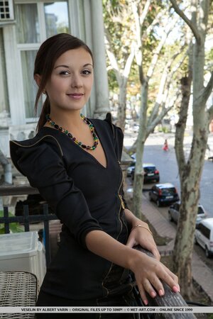 Under 20 years old girl shows skinny body with hot tanlines by the vintage piano