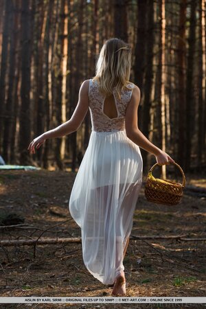 Cameraman takes pictures of sexy flame in white dress who gets completely naked