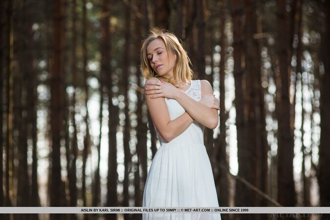Cameraman takes pictures of sexy flame in white dress who gets completely naked