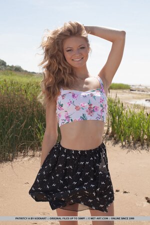 Lakeside becomes a place where nice girl with beautiful smile poses naked