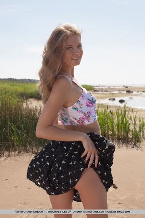 Lakeside becomes a place where nice girl with beautiful smile poses naked