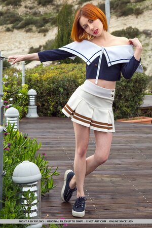 Energetic golden-haired teen exposes herself in the fresh air on a cloudy day