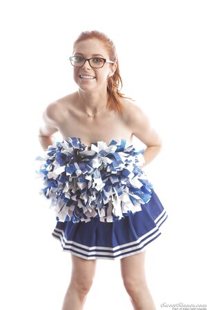 Funny red-haired high-school cheerleader Penny Pax strips while dancing