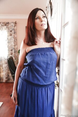 Black-haired mature strips near window while waiting for arrival of her lover
