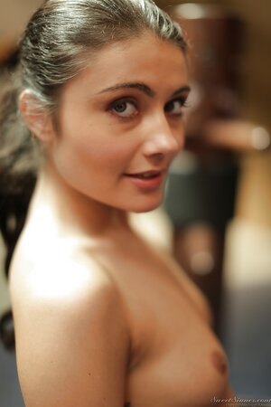 Athlete girl has just come to training room and instantly gets naked