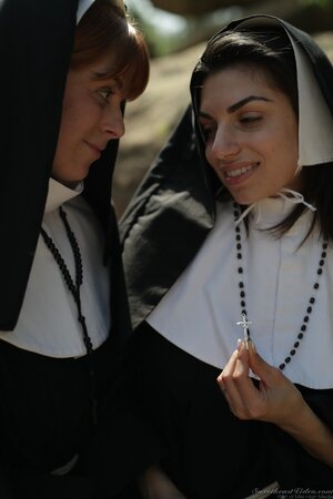 Lesbian nuns come to a secluded place and treat pussies with tongues