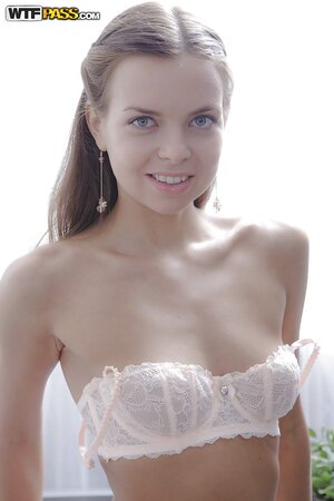 Cutie takes white lingerie off exposing muff and masturbating it with fingers