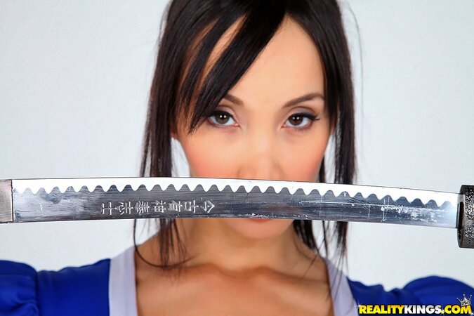 Cosplay photo session of Asian model with big boobs, samurai's saber, and fan