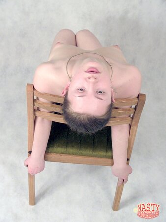 Shy babe performs a naked show on an old-fashioned stool in her empty room