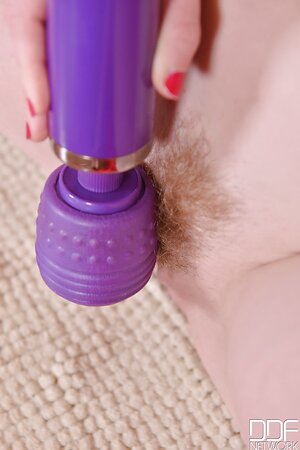 Girl takes a bath and after takes a Hitachi-vibrator to stimulate her muff
