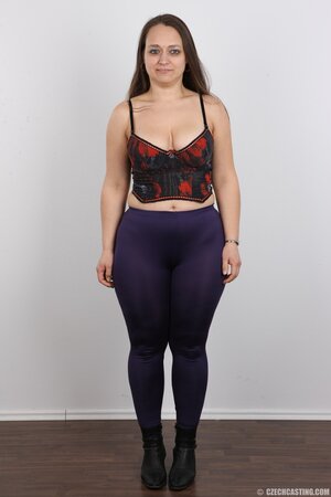 Woman turns photoshoot into dirty striptease exposing different-shaped tits