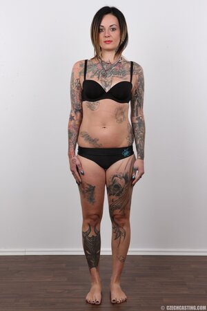 Diva with bright lipstick and tattoos all over her body exposes shaved snatch