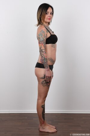 Diva with bright lipstick and tattoos all over her body exposes shaved snatch