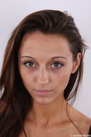 Latina teen honey takes clothes off item by item remaining completely naked