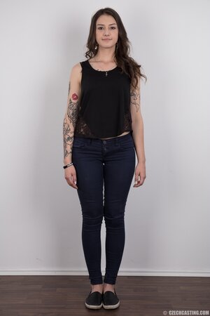 Small-tittied tattooed chick wants to boast about her tattoo sleeve in the studio