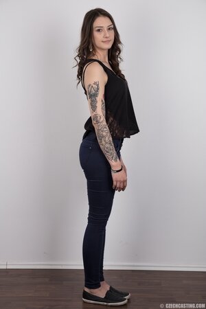 Small-tittied tattooed chick wants to boast about her tattoo sleeve in the studio